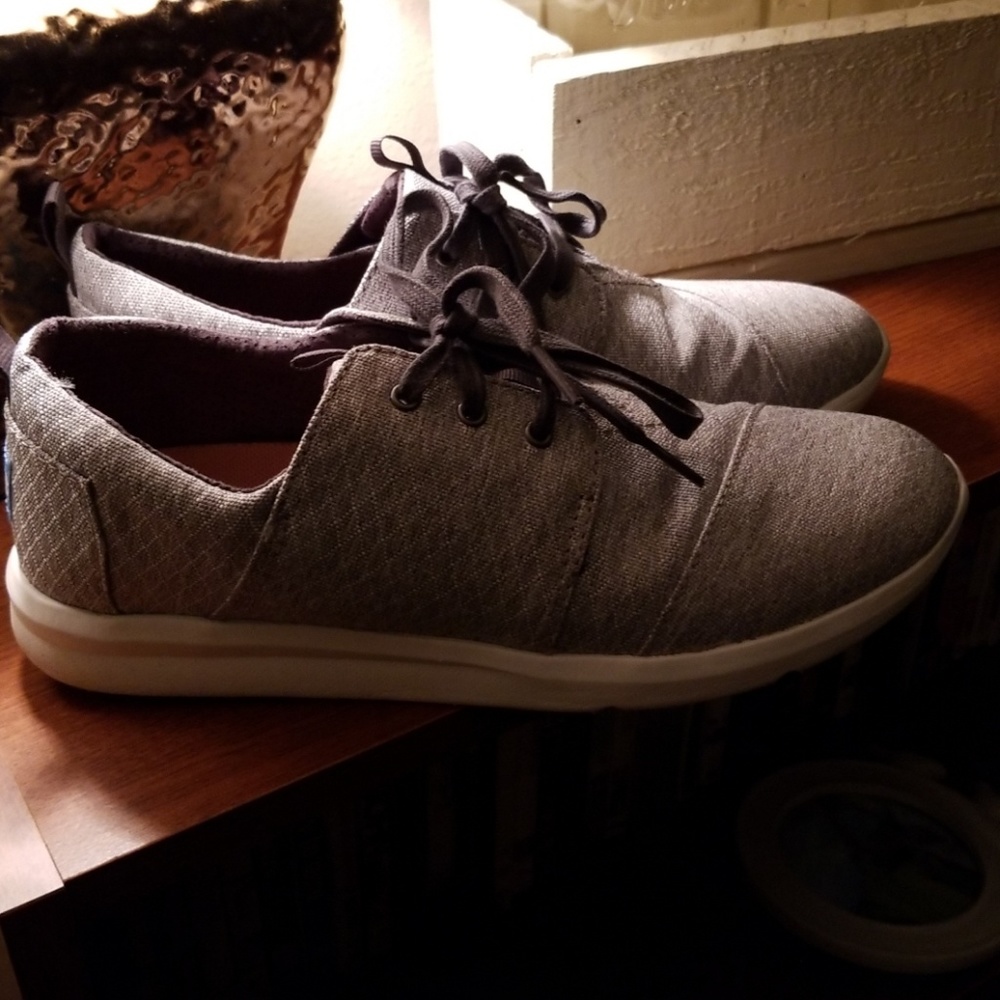 Gray TOMS sneakers.